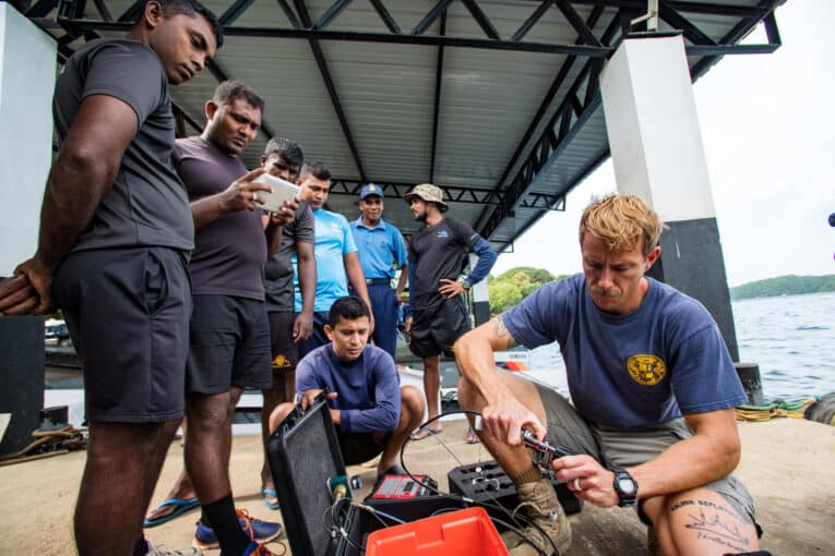 Navy Mobile Diving Salvage Unit diver performing air quality test while wearing G-Shock DW6600